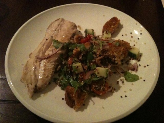 Pan fried fish with quinoa and bread salad.